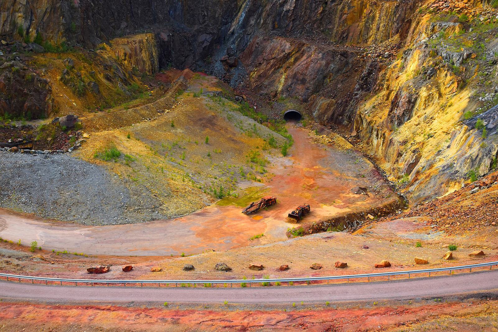 The Great Pit at Falun, a deep crater with red and ochre walls