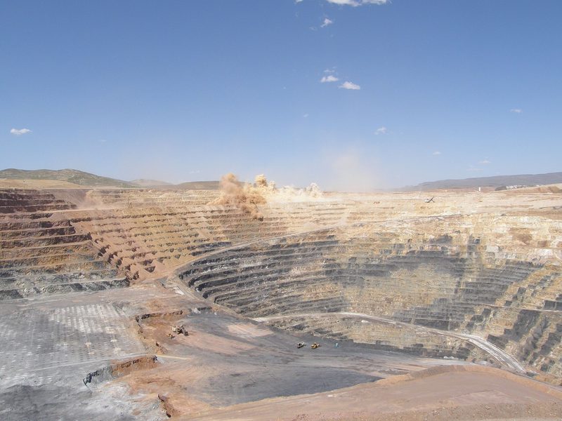 A blast raises dust in the Twin Creeks gold pit, now part of Nevada Gold Mines